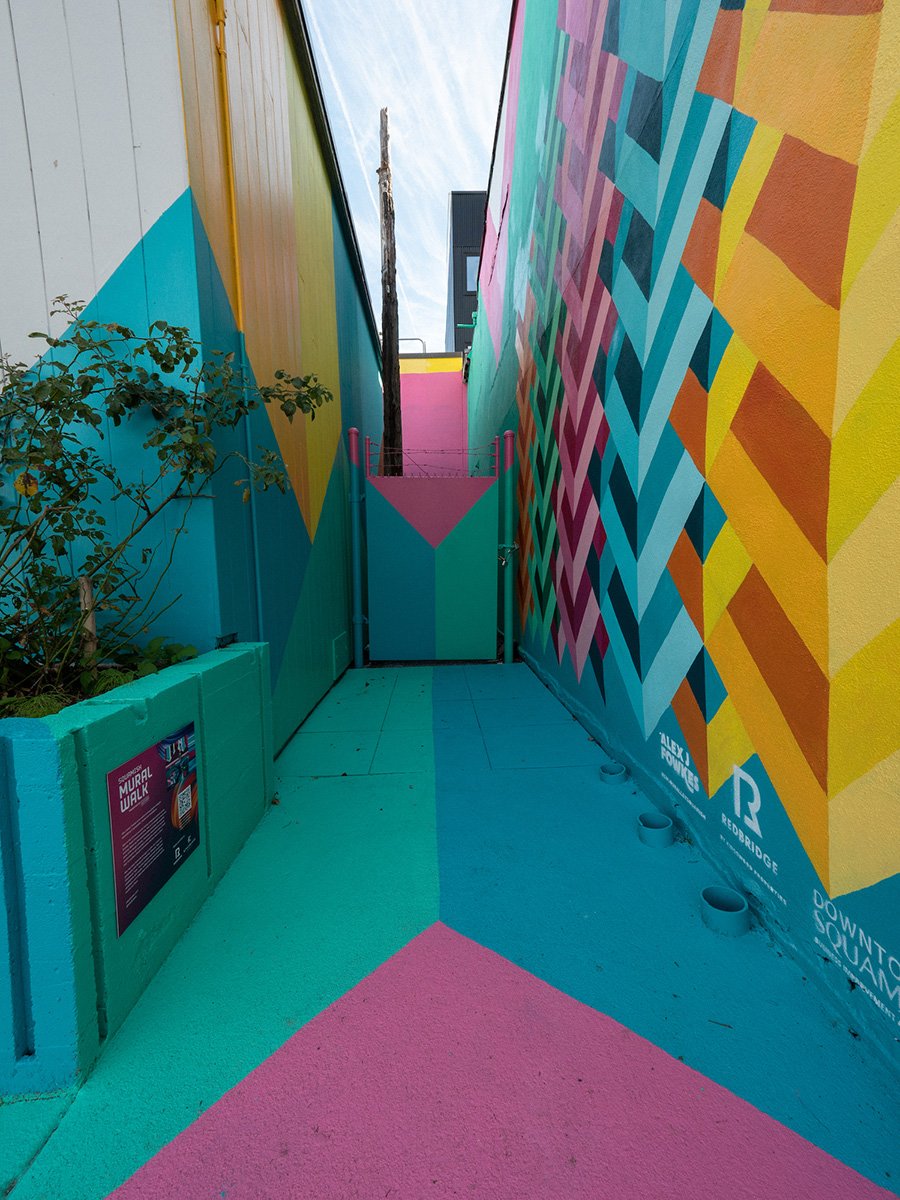 https://www.downtownsquamish.com/wp-content/uploads/2024/06/Squamish-Public-Art-Colour-Alley-DT1.jpg