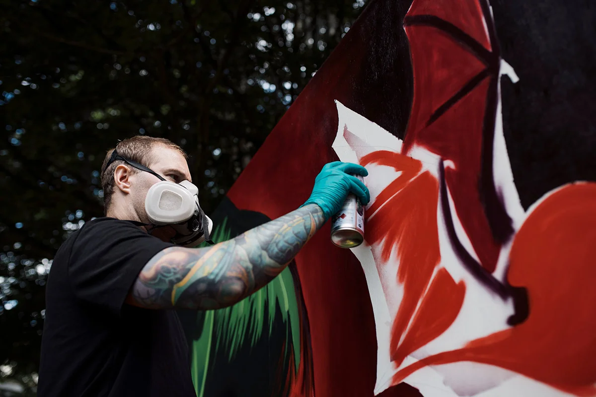 https://www.downtownsquamish.com/wp-content/uploads/2024/06/Squamish-Public-Art-Green-Woman-Mural-Alex-Wigley1.jpg-1.webp