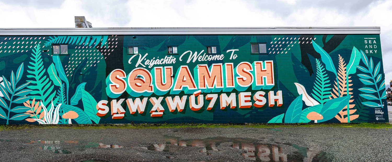 https://www.downtownsquamish.com/wp-content/uploads/2024/06/Squamish-Public-Art-Welcome-to-Squamish-Mural-Alex-Fowkes.jpg.webp