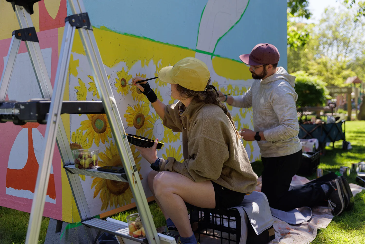 https://www.downtownsquamish.com/wp-content/uploads/2024/07/Squamish-Public-Art-Downtown-Squamish-BIA-Mural-Walk-Joy-in-Sunflowers1.webp